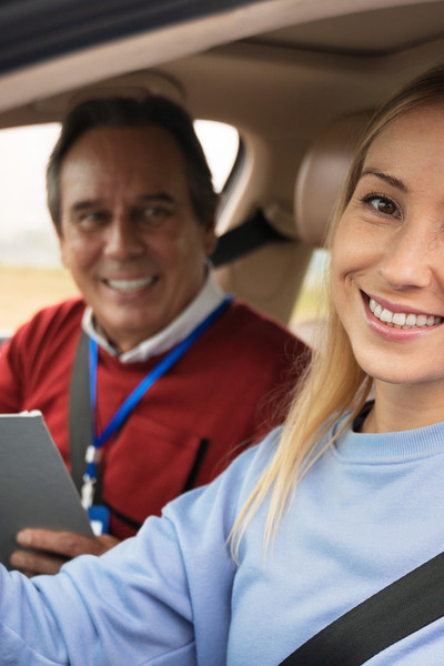 driving-teachers/woman-male-driving-instructor-driving-test